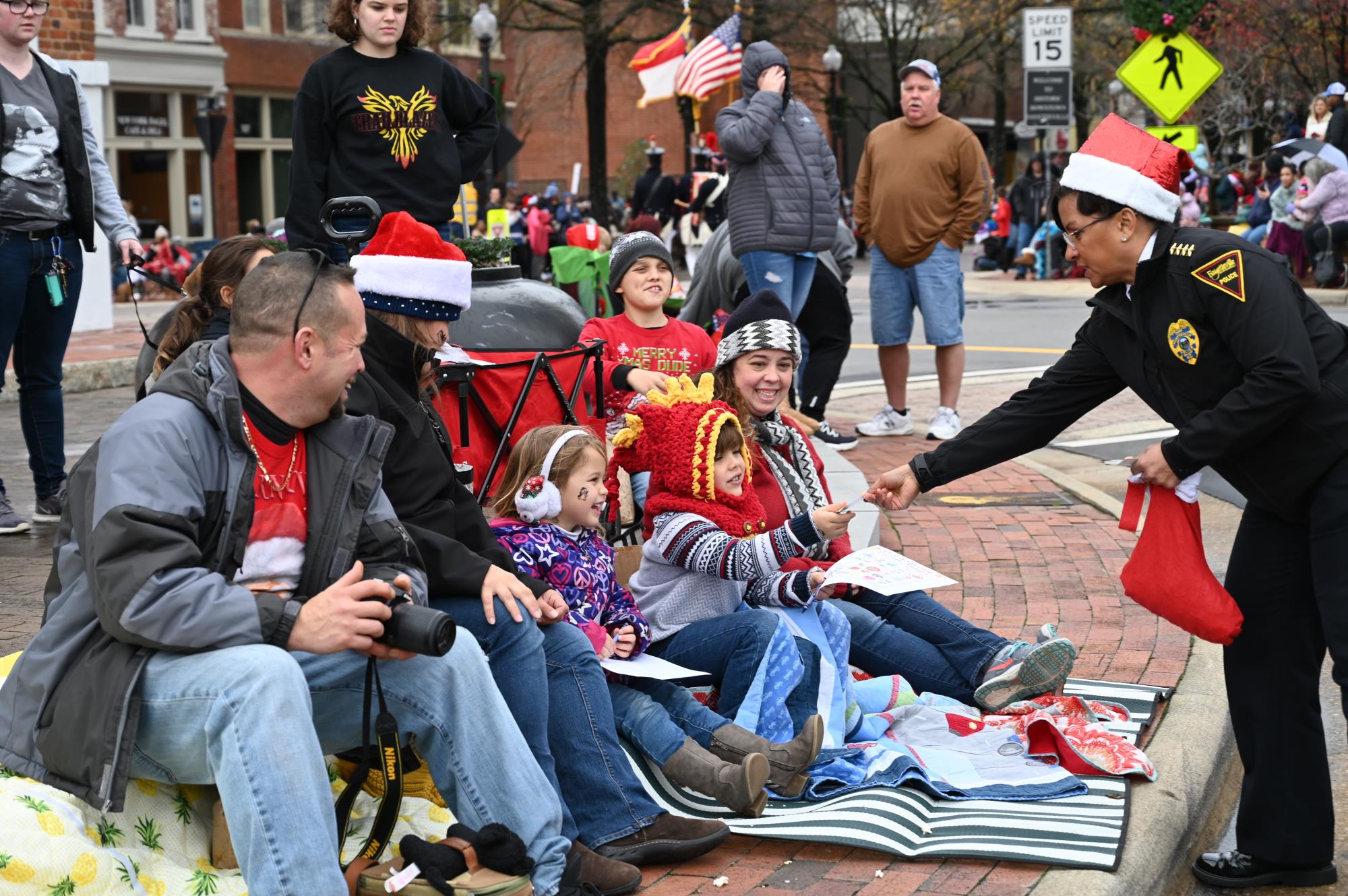 Chief Hawkins Passing Candy to Kid at Parade