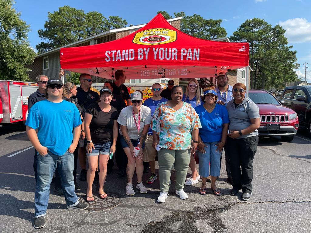 Group photo of members from the community standing together.